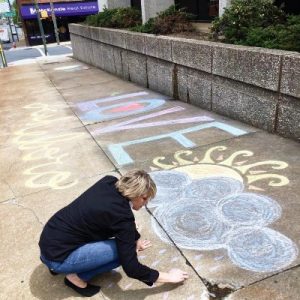 McKenzie Real Estate paints Asheboro with inspirational chalk art