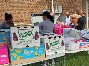 Partnership staff and volunteers setting up the August 2026 Food Pantry